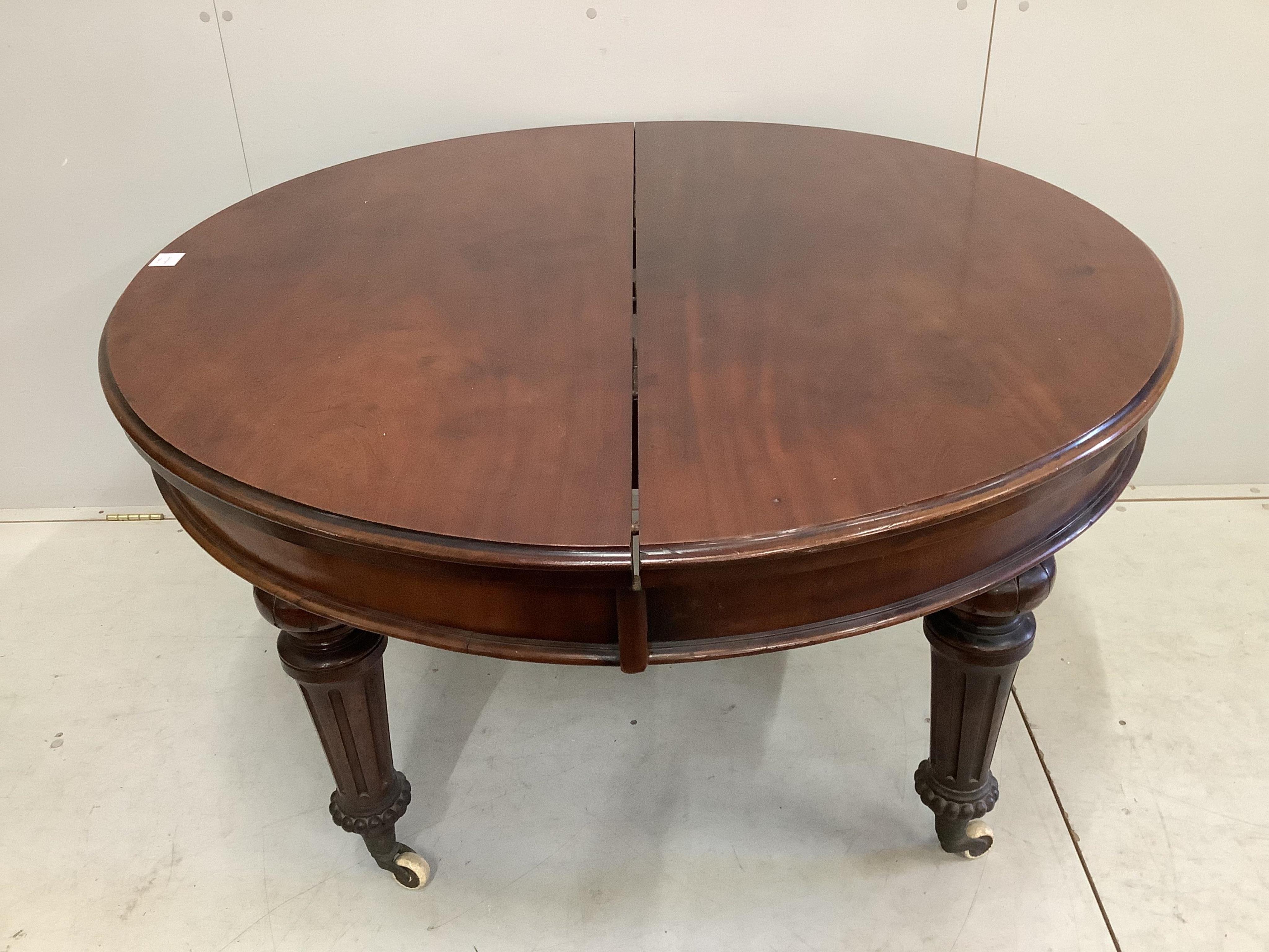 A late Victorian mahogany extending dining table, 240cm extended, three spare leaves, depth 120cm, height 73cm